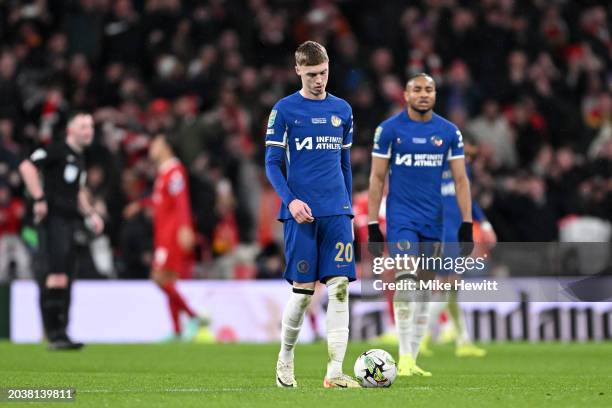 Cole Palmer of Chelsea looks dejected after Virgil van Dijk of Liverpool celebrates his team's first goal during the Carabao Cup Final match between...