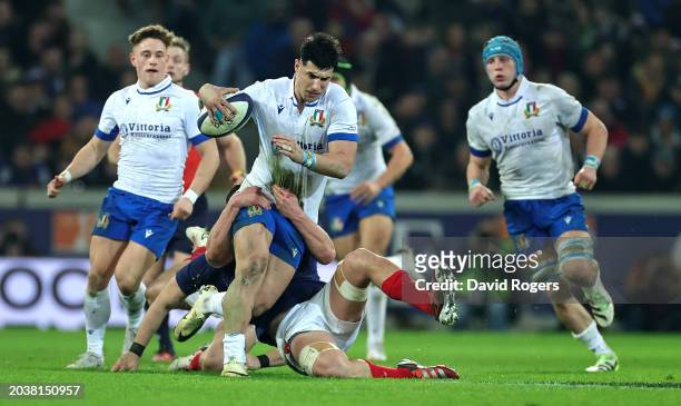 Tommaso Menoncello of Italy is tackled during the Guinness Six Nations 2024 match between France and Italy at Stade Pierre Mauroy on February 25,...