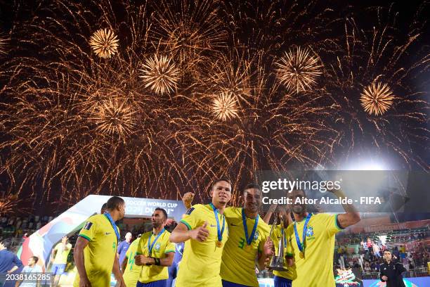 Filipe, Filipe, Edson Hulk of Brazil lift the FIFA Beach Soccer World Cup UAE 2024 trophy during the FIFA Beach Soccer World Cup UAE 2024 Final match...