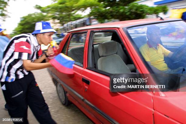 Street vendor sells hats with the colors of the Colombian flag in an avenue in the center of Barranquilla, 10 July 2001. The Copa America Soccer...