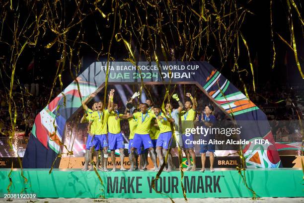 Players of Brazil lift the FIFA Beach Soccer World Cup UAE 2024 trophy during the FIFA Beach Soccer World Cup UAE 2024 Final match between Brazil and...