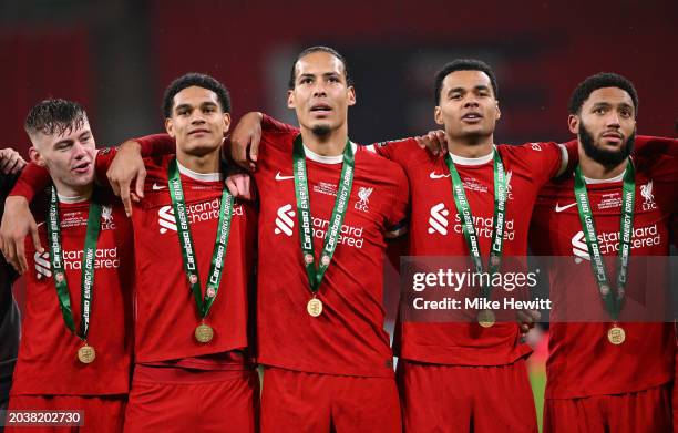 Conor Bradley, Jarell Quansah, Virgil van Dijk, Cody Gakpo and Joe Gomez of Liverpool celebrate with their medals after the team's victory in the...