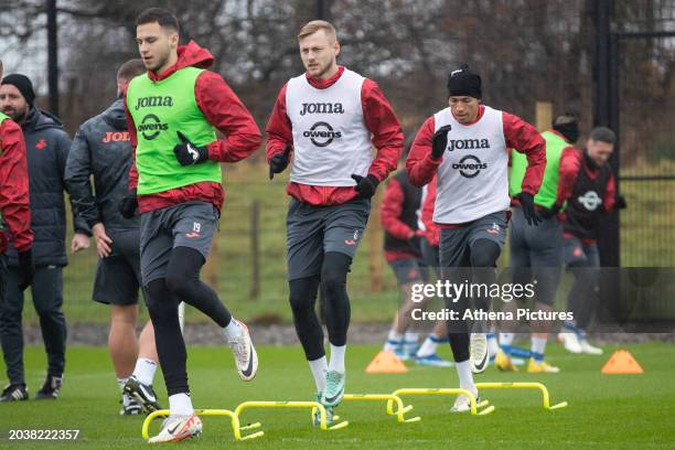 Mykola Kuharevich Harry Darling and Ronald of Swansea City warm upduring the Swansea City AFC Training Session at Fairwood Training Ground on...