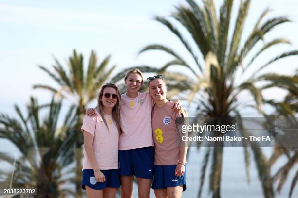 Niamh Charles, Lauren Hemp and Esme Morgan of England pose for a photo at La Quinta Football Center on February 21, 2024 in Marbella, Spain.