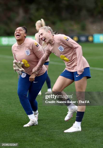 Khiara Keating and Alex Greenwood of England laugh during a training session at La Quinta Football Center on February 25, 2024 in Marbella, Spain.