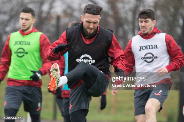 Matt Grimes of Swansea City stretches during the Swansea City AFC Training Session at Fairwood Training Ground on February 28, 2023 in Swansea, Wales.