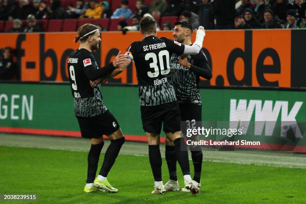 Vincenzo Grifo of SC Freiburg celebrates scoring his team's first goal from a penalty kick with team mates during the Bundesliga match between FC...