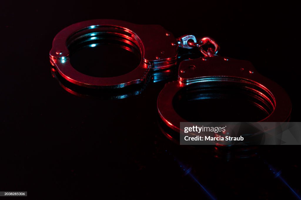 Handscuffs at Night with Red and Blue Light