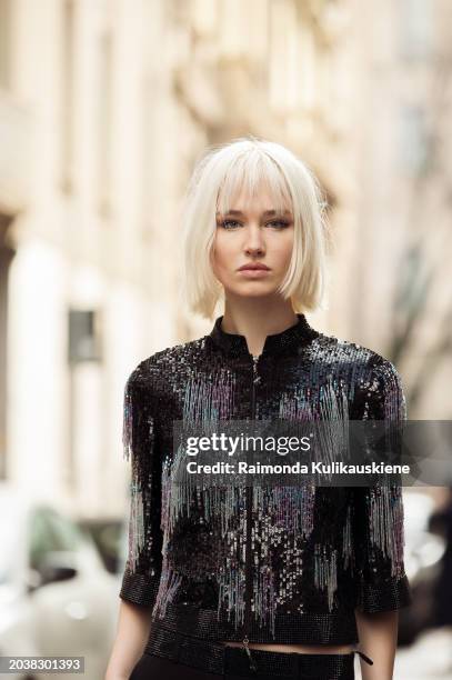 Lara Cosima Henckel von Donnersmarck wears black pants, and a black top with hanging colorful beads decorations outside Giorgio Armani during the...