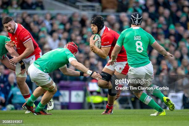 February 24: Dafydd Jenkins of Wales defended by Josh van der Flier of Ireland and Caelan Doris of Ireland during the Ireland V Wales, Six Nations...