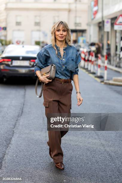 Ekaterina Mamaeva wears denim shirt Chloe, brown pants Peter Do, shoes By Far, grey bag Celine, earrings By Pariah, necklace Tiffany & Co outside...