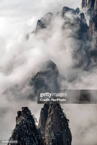 The landscape of Huangshan Mountain is shrouded in clouds in Huangshan City, Anhui Province, China, on January 29, 2018.