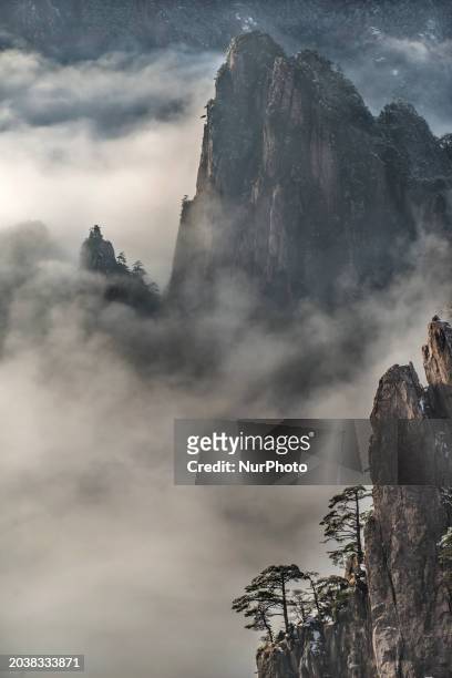 The landscape of Huangshan Mountain is shrouded in clouds in Huangshan City, Anhui Province, China, on January 29, 2018.