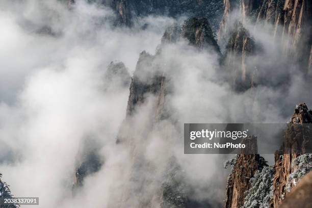 The landscape of Huangshan Mountain is shrouded in clouds in Huangshan City, Anhui Province, China, on January 29, 2018.