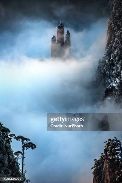 The landscape of Huangshan Mountain is shrouded in clouds in Huangshan City, Anhui Province, China, on January 29, 2018.