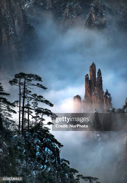 The landscape of Huangshan Mountain is shrouded in clouds in Huangshan City, Anhui Province, China, on January 29, 2018.