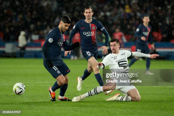 Marco Asensio of PSG, Baptiste Santamaria of Rennes in action during the Ligue 1 Uber Eats match between Paris Saint-Germain and Stade Rennais FC at...