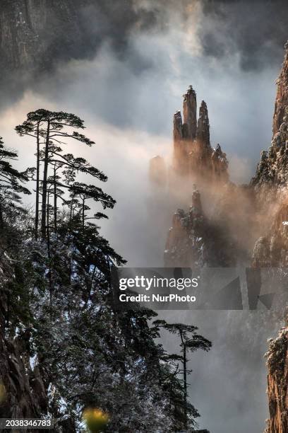 The landscape of Huangshan Mountain is shrouded in clouds in Huangshan City, Anhui Province, China, on January 29, 2018.