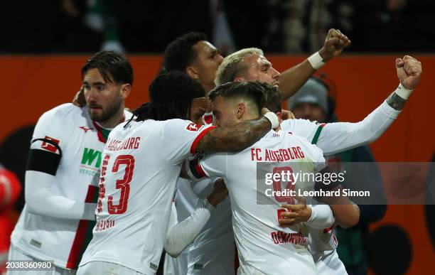 Players of FC Augsburg celebrate their side's second goal scored by Arne Engels of FC Augsburg during the Bundesliga match between FC Augsburg and...