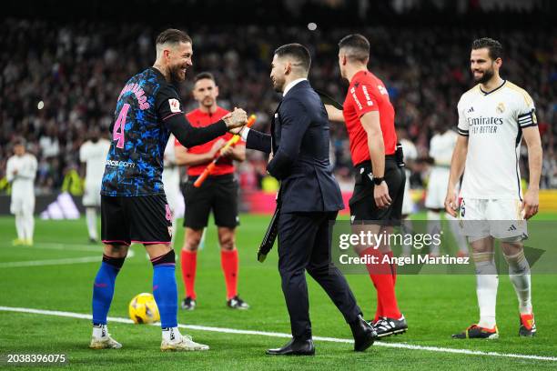 Ilia Topuria, UFC Featherweight Champion, shakes hands with Sergio Ramos of Sevilla FC on the pitch prior to the LaLiga EA Sports match between Real...