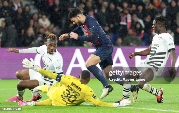 Goncalo Ramos of Paris Saint-Germain is tackle by Steve Mandanda of Rennes is made penalty during the Ligue 1 Uber Eats match between Paris...