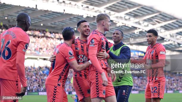 Jarrad Branthwaite of Everton celebrates his goal with Dwight McNeil Ashley Young and Ben Godfrey during the Premier League match between Brighton &...