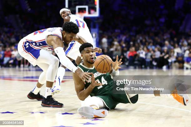 Tobias Harris of the Philadelphia 76ers and Giannis Antetokounmpo of the Milwaukee Bucks challenge for the ball during the third quarter at the Wells...