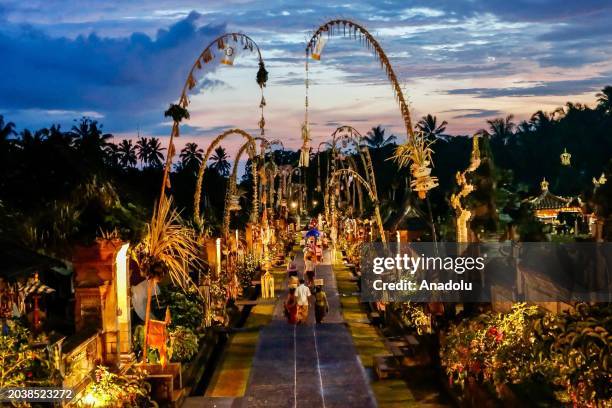 Tourists enjoy scenes of Galungan celebrations at Penglipuran Village, titled as the Best Tourism Village 2024 by UNWTO, in Bangli Regency of Bali,...