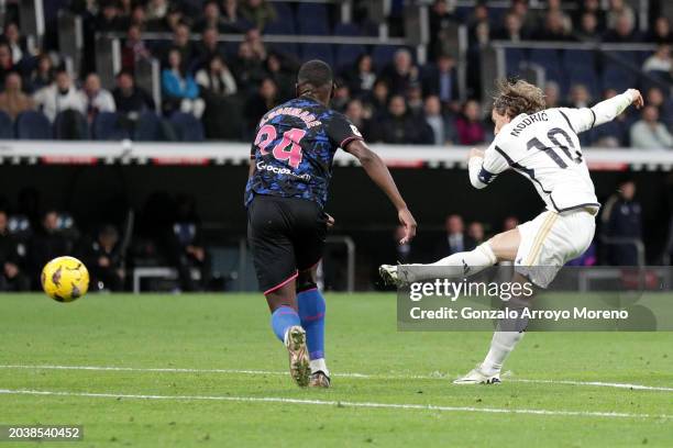 Luka Modric of Real Madrid CF scores their opening goal during La Liga EA Sports match between Real Madrid and Sevilla FC at Estadio Santiago...
