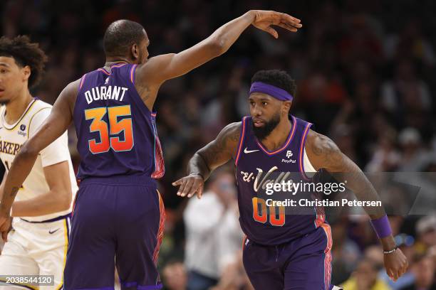 Royce O'Neale of the Phoenix Suns is congratulated by Kevin Durant after a three-point shot against the Los Angeles Lakers during the first half of...