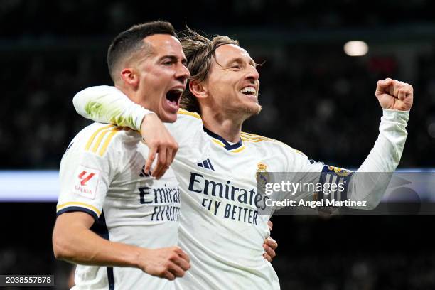 Luka Modric of Real Madrid celebrates scoring his team's first goal with Lucas Vazquez during the LaLiga EA Sports match between Real Madrid CF and...