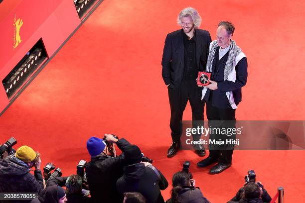 Guillaume Cailleau and Ben Russell pose with their Encounters Award for Best Film for the movie "DIRECT ACTION" on the red carpet after the Award...