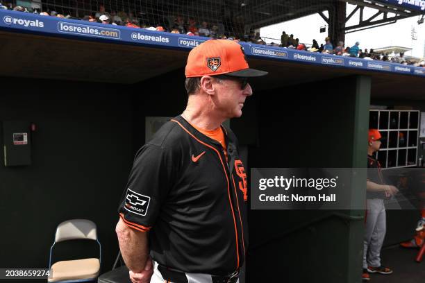 Manager Bob Melvin of the San Francisco Giants looks on against the Texas Rangers during a spring training game at Surprise Stadium on February 25,...