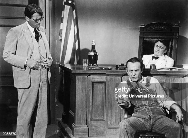 American actor Gregory Peck, as Atticus Finch, questions a witness in court in a still from the film, 'To Kill A Mockingbird,' directed by Robert...