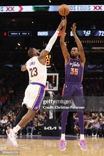 Kevin Durant of the Phoenix Suns puts up a three-point shot over LeBron James of the Los Angeles Lakers during the second half of the NBA game at...