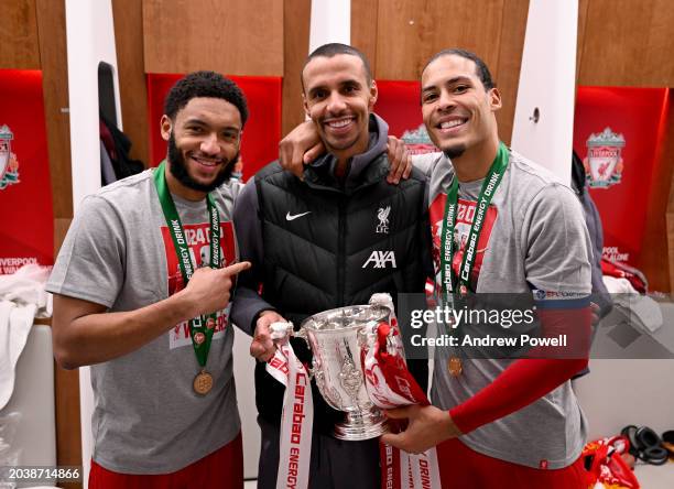 Joe Gomez, Joel Matip and Virgil van Dijk captain of Liverpool with the Carabao Cup in the dressing room after the Carabao Cup Final between Chelsea...