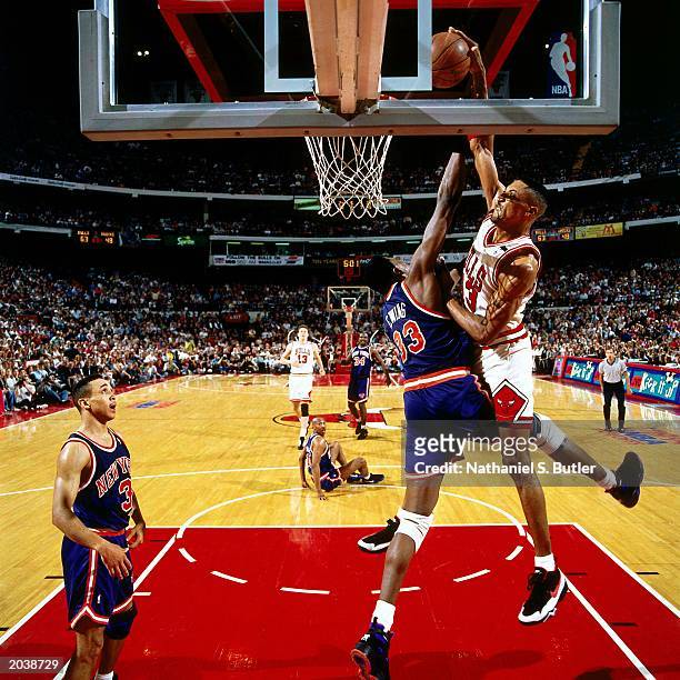 Scottie Pippen of the Chicago Bulls goes for a dunk over Patrick Ewing of the New York Knicks in Game six of the Eastern Conference Semifinals during...