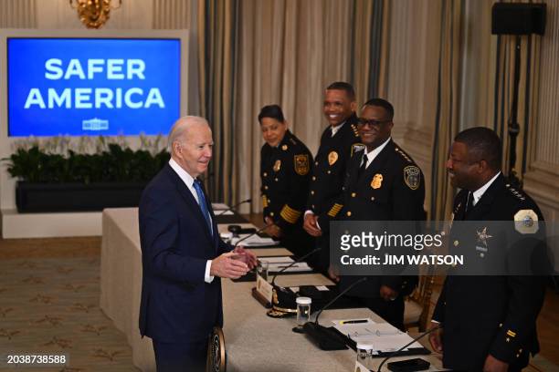 President Joe Biden greets police officers as he arrives to speak about his administration's efforts to fight crime and make our communities safer,...