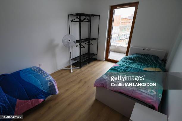 This photograph taken on February 27, 2024 shows an interior view of an Olympic village residential accommodation room where athletes will be housed...