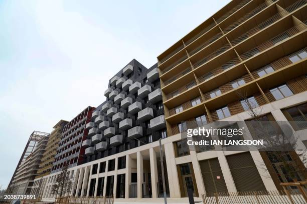 This photograph taken on February 27, 2024 shows a view of residential accommodation buildings in the Olympic village where the athletes will be...
