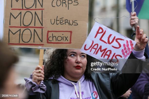 Protester is holding a sign that reads ''My body, My uterus, My choice'' during a silent gathering at Place de la Sorbonne, organized by the...