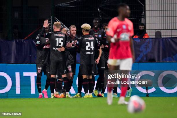 Valenciennes' players celebrates after scoring their team's first goal during the French Cup quarter final match between FC Rouen and Valenciennes FC...