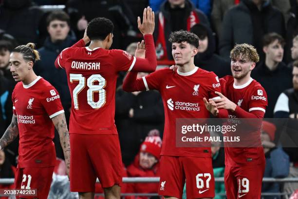 Liverpool's English striker Lewis Koumas celebrates with Liverpool's English defender Jarell Quansah after scoring the opening goal of the English FA...