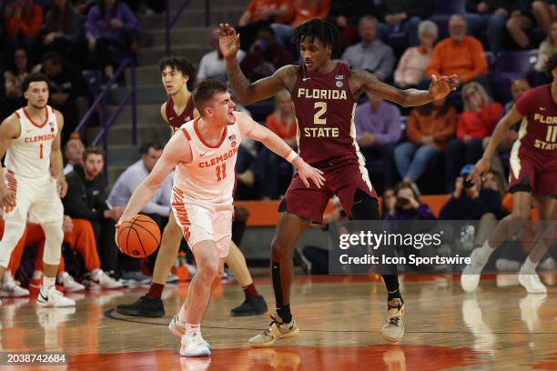 Clemson Tigers guard Joseph Girard III and Florida State Seminoles forward Jamir Watkins during a college basketball game between the Florida State...