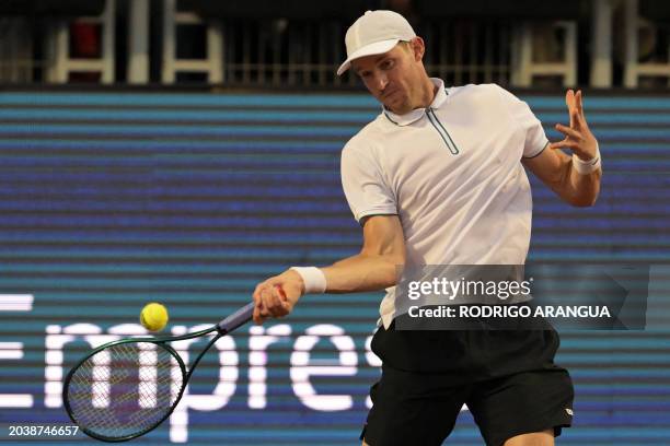 Chile's Nicolas Jarry returns the ball to Argentina's Federico Coria their ATP Santiago Open men's singles round of 16 match at the Club San Carlos...