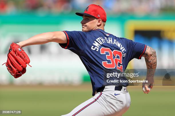 Atlanta Braves Pitcher AJ Smith-Shawver delivers a pitch to the place during the spring training game between the Atlanta Braves and the Philadelphia...