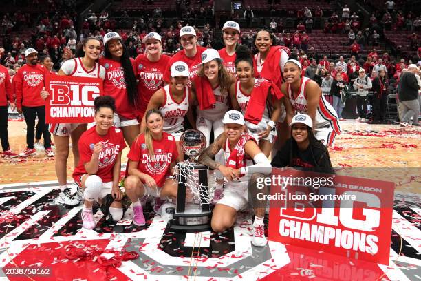 The Ohio State Buckeyes Women's Basketball team poses for a photo with the Big Ten Championship Trophy after the game against the Michigan Wolverines...