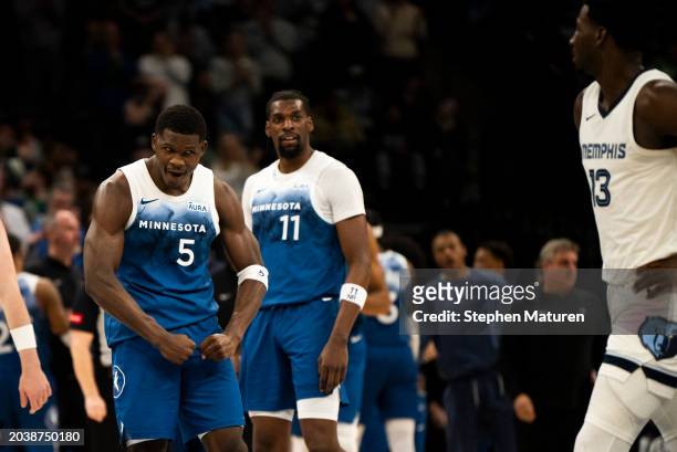 Anthony Edwards of the Minnesota Timberwolves flexes at Jaren Jackson Jr. #13 of the Memphis Grizzlies during a timeout in the third quarter at...
