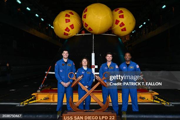 Canadian Space Agency astronaut Jeremy Hansen, NASA Astronaut Christina Koch, NASA Astronaut Reid Wiseman, and NASA Astronaut Victor J. Glover stand...