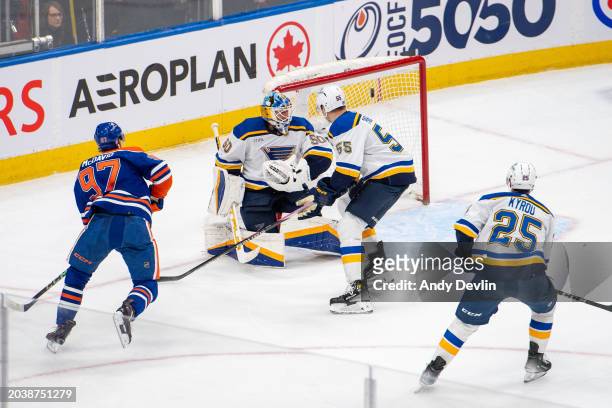 Connor McDavid of the Edmonton Oilers scores the overtime game winning goal against Jordan Binnington of the St. Louis Blues at Rogers Place on...
